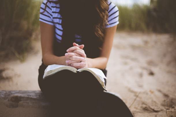 praying on the beach